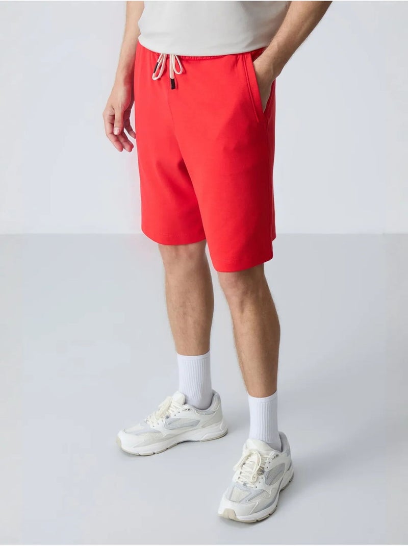 Calções de moletom masculinos em mistura de algodão tommy Vermelho - Kiabi