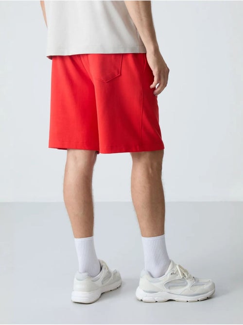 Calções de moletom masculinos em mistura de algodão tommy - Kiabi Calções de moletom masculinos em mistura de algodão tommy - Kiabi