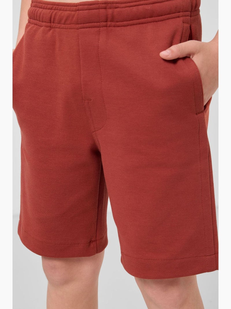 Calções em mistura de algodão tommy Terracota - Kiabi