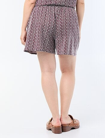 Calções largos com estampados bordados