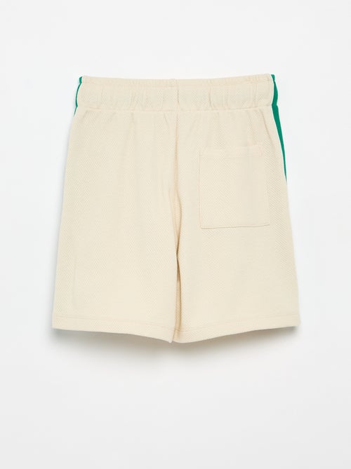 Calções largos com riscas contrastantes nas laterais - Kiabi