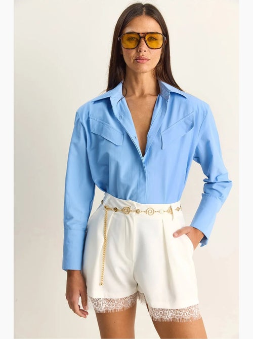 Camisa casual de popelina de manga comprida com botões e bolso lucci - Kiabi Camisa casual de popelina de manga comprida com botões e bolso lucci - Kiabi