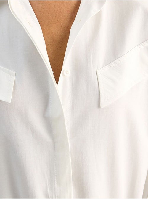 Camisa casual de popelina de manga comprida com botões e bolso lucci - Kiabi Camisa casual de popelina de manga comprida com botões e bolso lucci - Kiabi