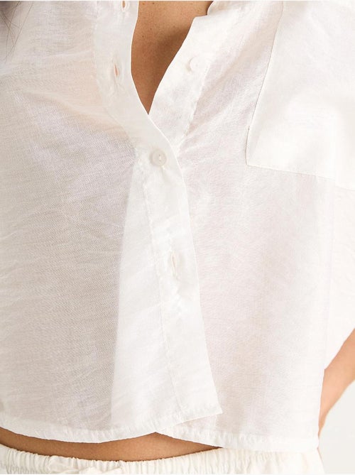 Camisa com detalhe de bolso único e manga curta lucci - Kiabi Camisa com detalhe de bolso único e manga curta lucci - Kiabi