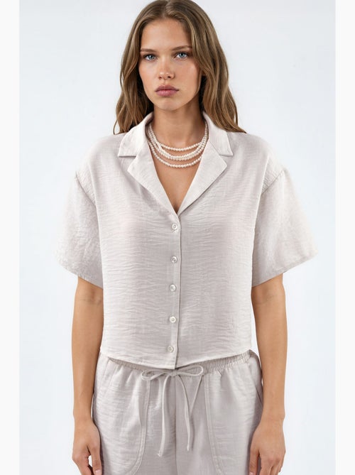 Camisa curta texturada com fecho de botões busem - Kiabi Camisa curta texturada com fecho de botões busem - Kiabi