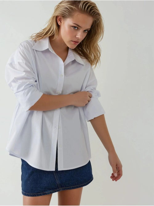 Camisa de algodão com ajuste regular e detalhes de botões hiccup - Kiabi Camisa de algodão com ajuste regular e detalhes de botões hiccup - Kiabi