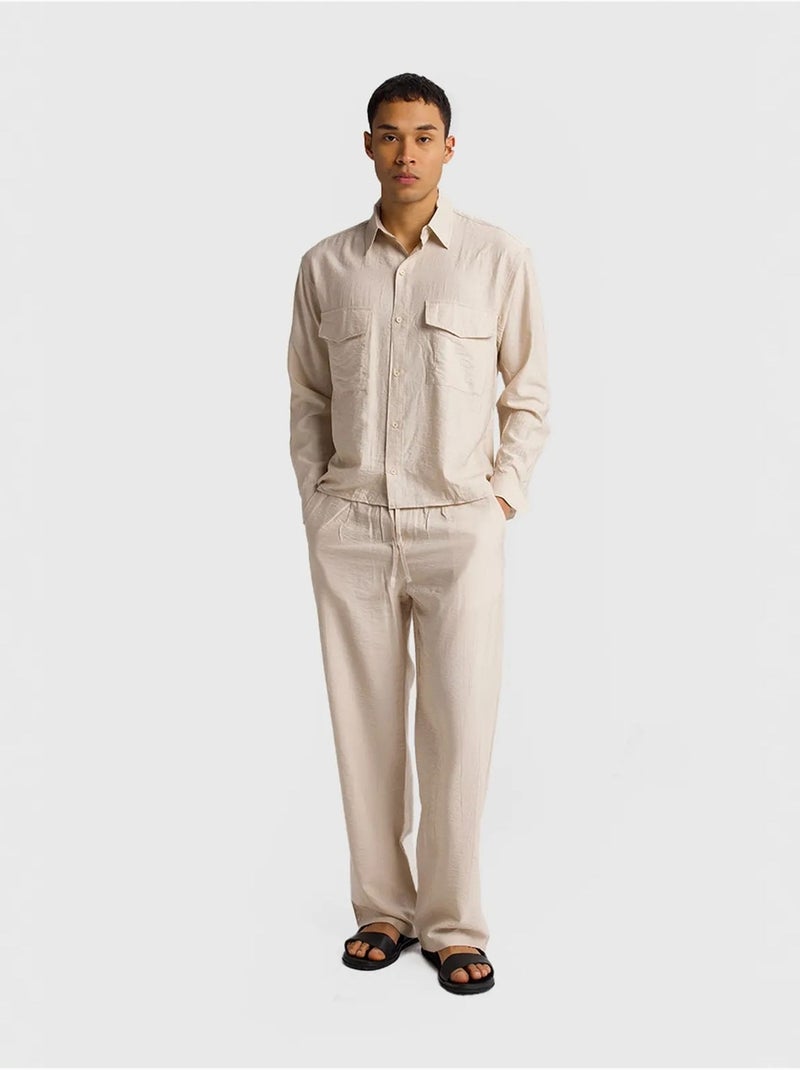 Camisa de manga comprida com botões e bolso giesto Bege-argila - Kiabi