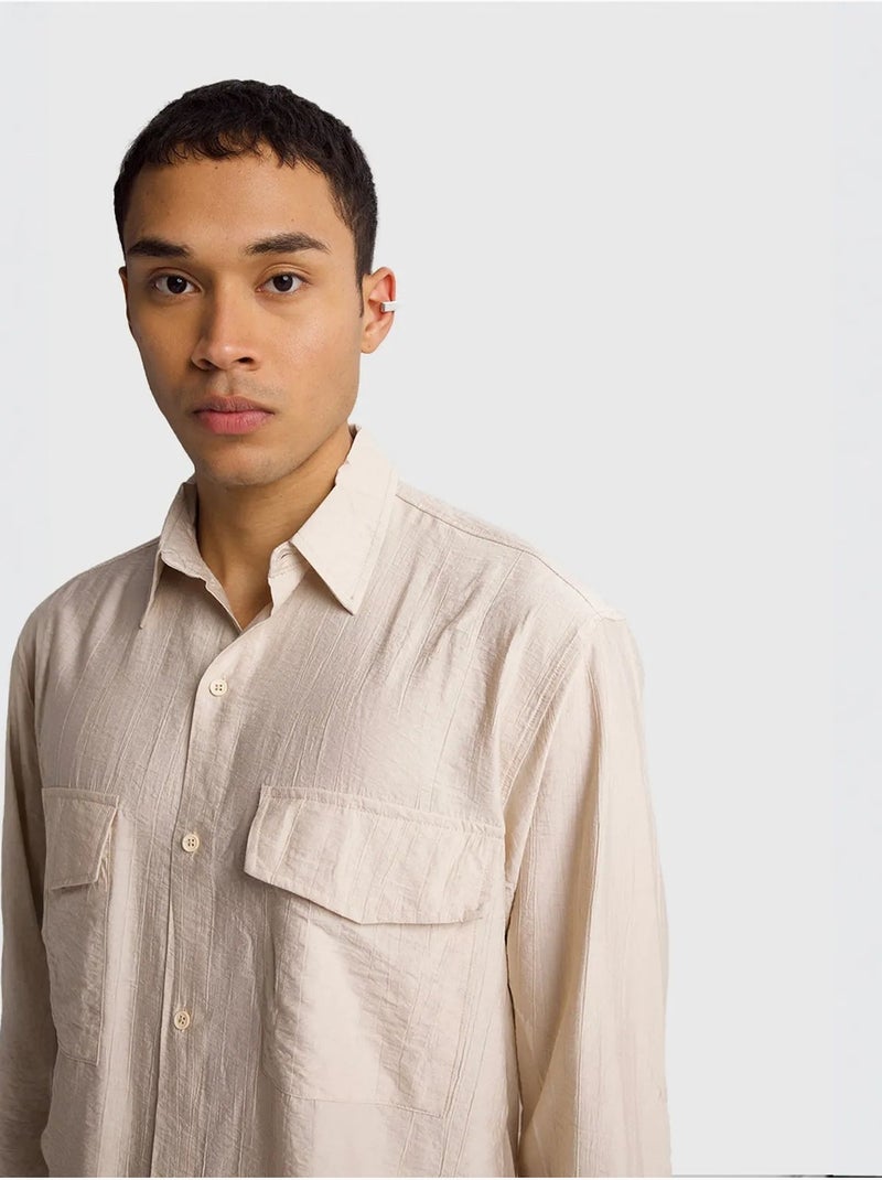 Camisa de manga comprida com botões e bolso giesto Bege-argila - Kiabi