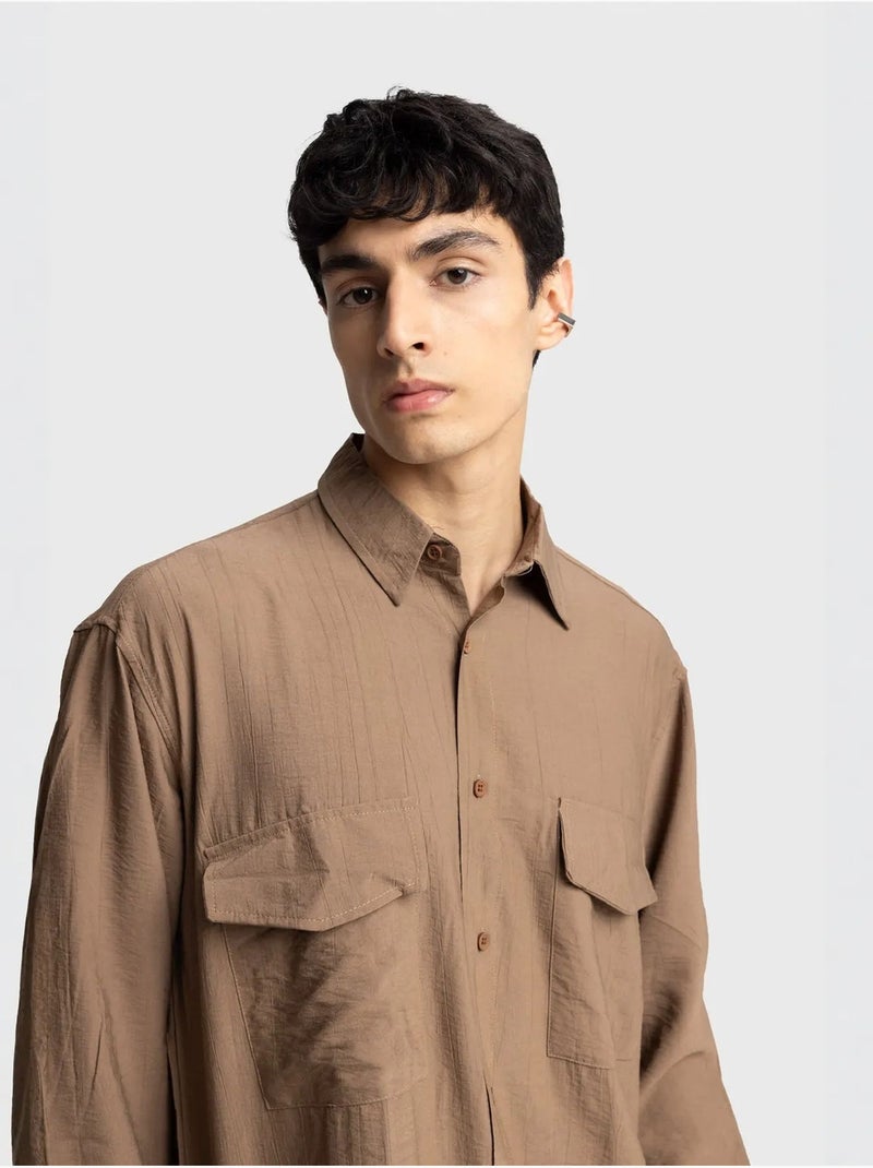 Camisa de manga comprida com botões e bolso giesto Greige - Kiabi