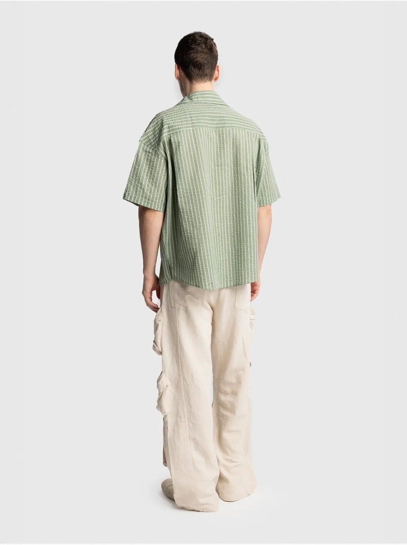 Camisa de manga curta às riscas texturadas com bolso giesto Verde - Kiabi