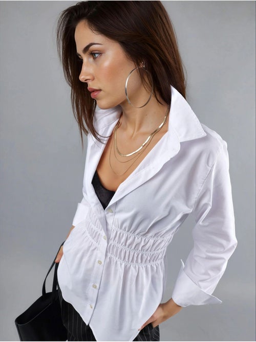 Camisa de popelina de manga comprida com botões e detalhe franzido busem - Kiabi Camisa de popelina de manga comprida com botões e detalhe franzido busem - Kiabi