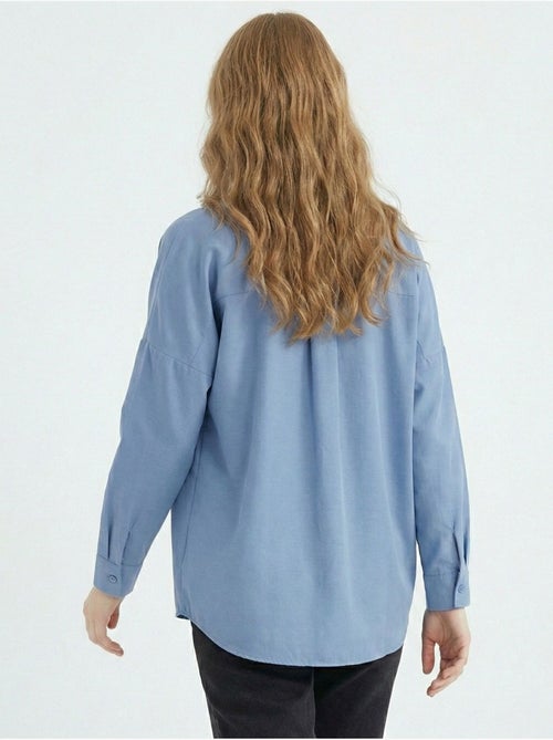Camisa de popelina relaxed fit com fecho de botões bdart - Kiabi Camisa de popelina relaxed fit com fecho de botões bdart - Kiabi