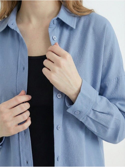 Camisa de popelina relaxed fit com fecho de botões bdart - Kiabi Camisa de popelina relaxed fit com fecho de botões bdart - Kiabi