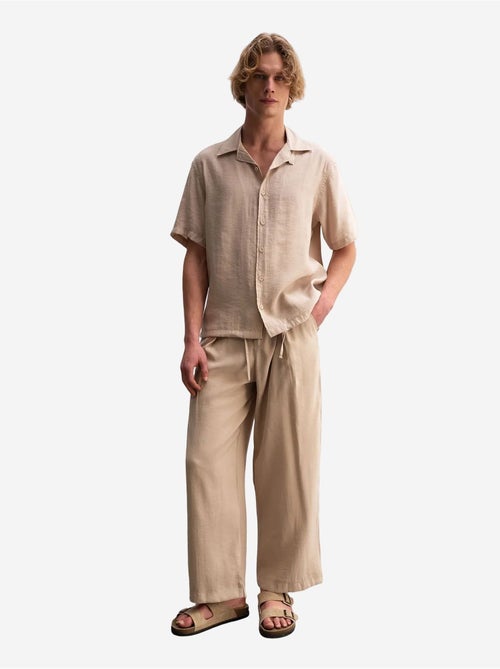 Camisa em tecido de mangas curtas de corte descontraído com detalhe de laço giesto - Kiabi Camisa em tecido de mangas curtas de corte descontraído com detalhe de laço giesto - Kiabi