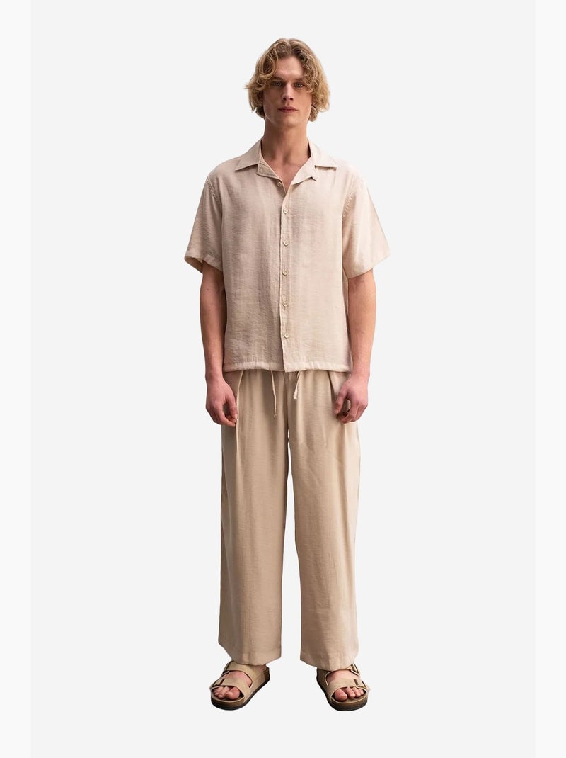 Camisa em tecido de mangas curtas de corte descontraído com detalhe de laço giesto Bege natural - Kiabi