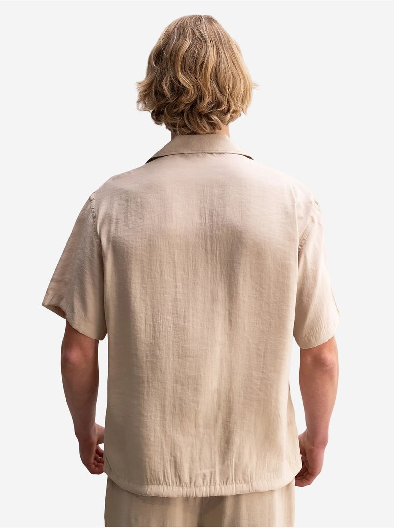 Camisa em tecido de mangas curtas de corte descontraído com detalhe de laço giesto Bege natural - Kiabi
