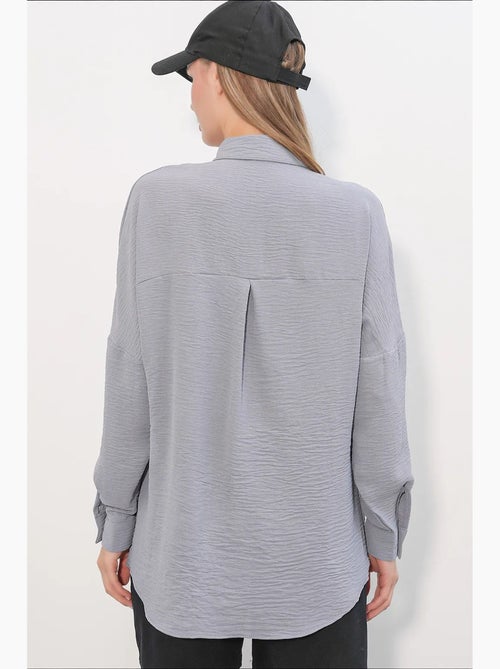 Camisa feminina de poliéster elástico bdart - Kiabi Camisa feminina de poliéster elástico bdart - Kiabi