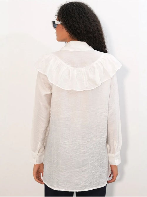 Camisa longa relaxed com detalhe de folho bdart - Kiabi Camisa longa relaxed com detalhe de folho bdart - Kiabi