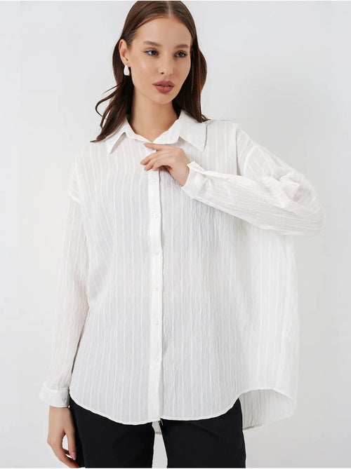 Camisa oversize texturizada às riscas com fecho de botões bdart - Kiabi Camisa oversize texturizada às riscas com fecho de botões bdart - Kiabi