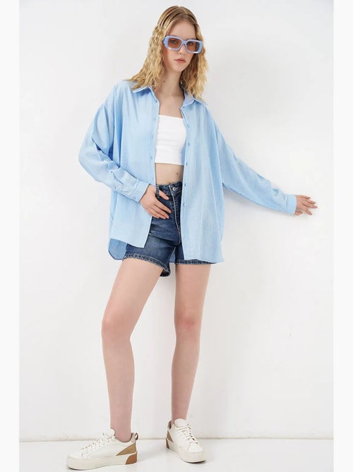 Camisa oversized abotoada de manga comprida bdart - Kiabi Camisa oversized abotoada de manga comprida bdart - Kiabi