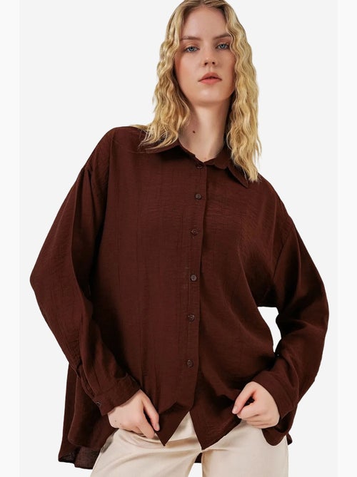 Camisa oversized abotoada de manga comprida bdart - Kiabi Camisa oversized abotoada de manga comprida bdart - Kiabi