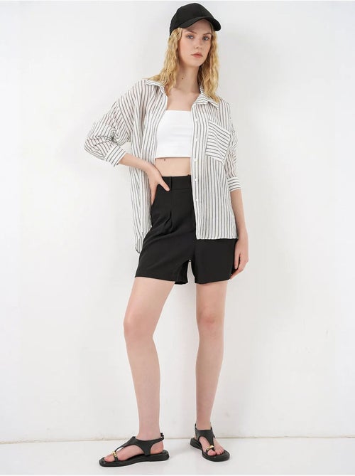 Camisa oversized às riscas com abotoamento frontal bdart - Kiabi Camisa oversized às riscas com abotoamento frontal bdart - Kiabi