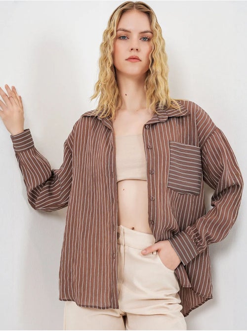 Camisa oversized às riscas com abotoamento frontal bdart - Kiabi Camisa oversized às riscas com abotoamento frontal bdart - Kiabi