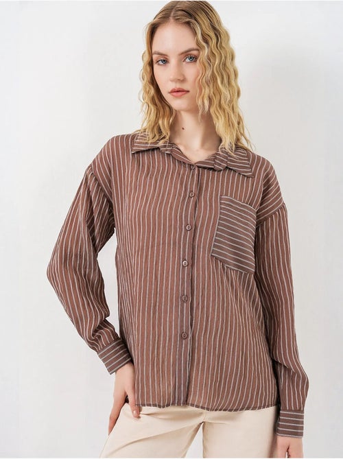 Camisa oversized às riscas com abotoamento frontal bdart - Kiabi Camisa oversized às riscas com abotoamento frontal bdart - Kiabi