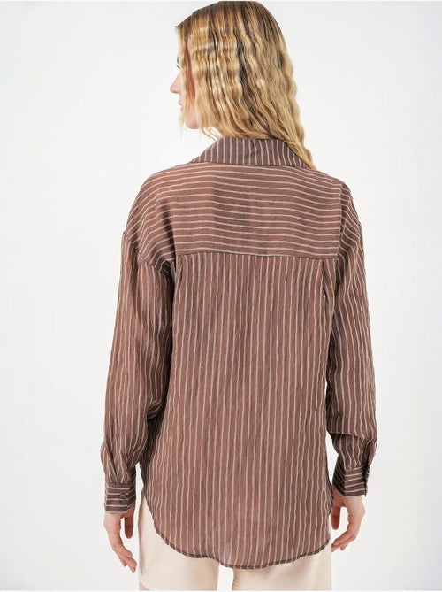 Camisa oversized às riscas com abotoamento frontal bdart - Kiabi Camisa oversized às riscas com abotoamento frontal bdart - Kiabi
