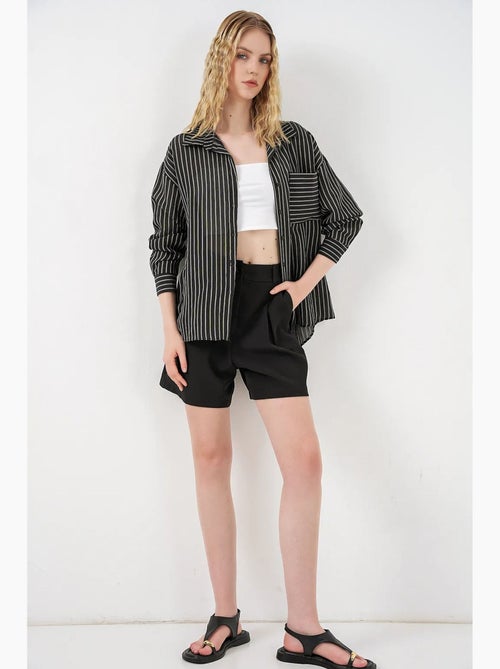 Camisa oversized às riscas com abotoamento frontal bdart - Kiabi Camisa oversized às riscas com abotoamento frontal bdart - Kiabi