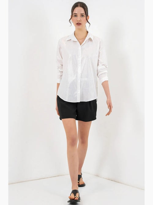 Camisa oversized com estampado abstrato e abotoamento frontal bdart - Kiabi Camisa oversized com estampado abstrato e abotoamento frontal bdart - Kiabi