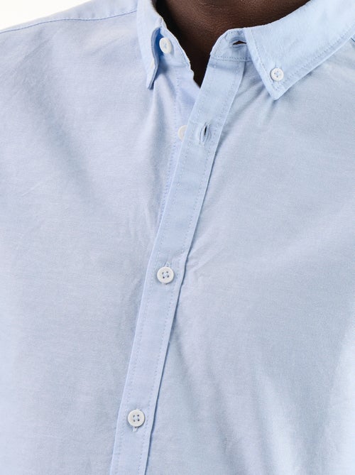 Camisa oxford com abertura abotoada - Kiabi Camisa oxford com abertura abotoada - Kiabi