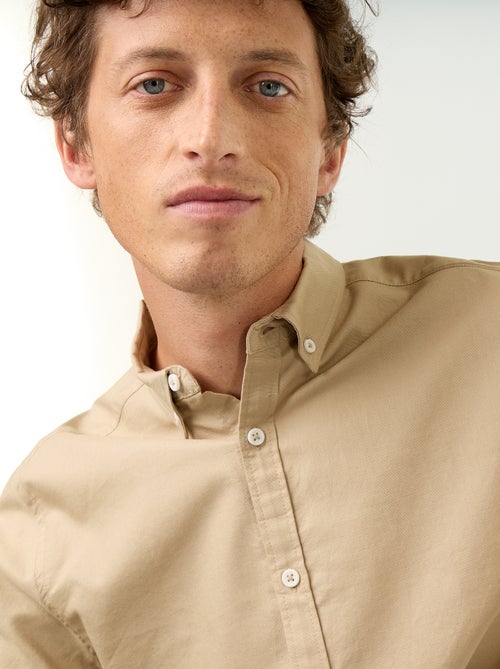 Camisa oxford com abertura abotoada - Kiabi Camisa oxford com abertura abotoada - Kiabi
