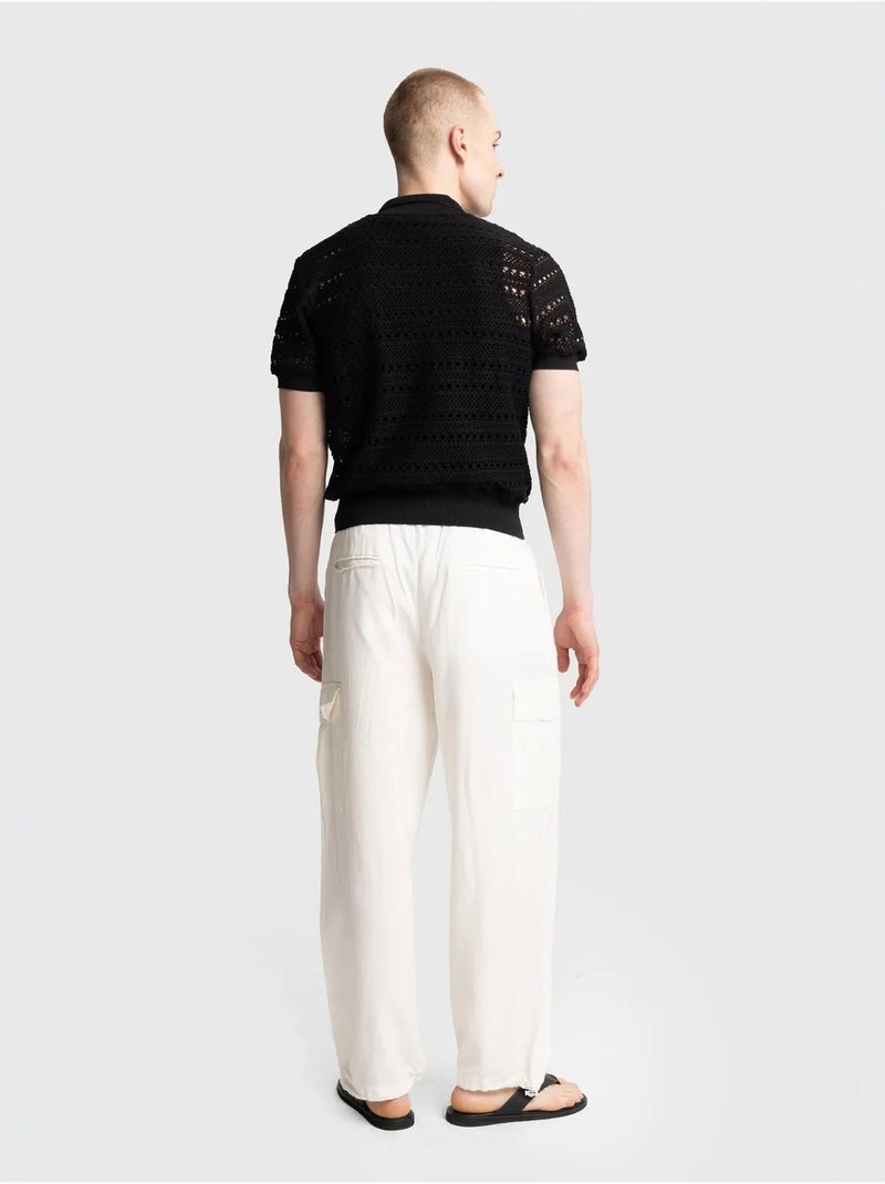 Camisa polo de malha texturada com fecho de botões giesto Preto - Kiabi