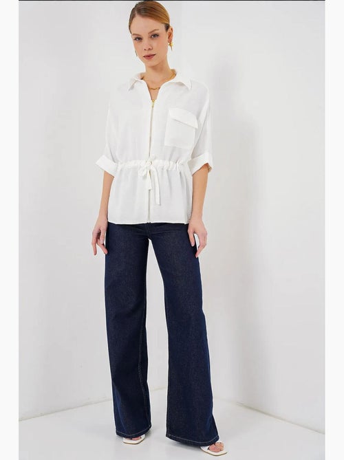 Camisa texturizada com fecho de correr e bolso bdart - Kiabi Camisa texturizada com fecho de correr e bolso bdart - Kiabi