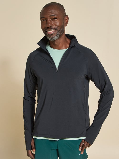 Camiseta desportiva com gola alta com fecho - (ekstract) - Kiabi Camiseta desportiva com gola alta com fecho - (ekstract) - Kiabi