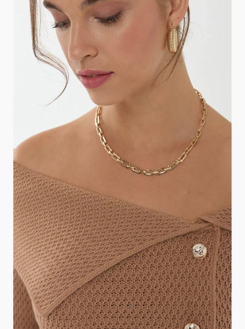 Camisola com detalhe de botão e ombro de fora hiccup - Kiabi Camisola com detalhe de botão e ombro de fora hiccup - Kiabi