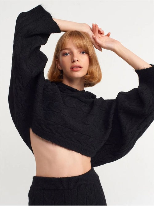 Camisola curta oversized de malha com tranças e capuz - Kiabi Camisola curta oversized de malha com tranças e capuz - Kiabi