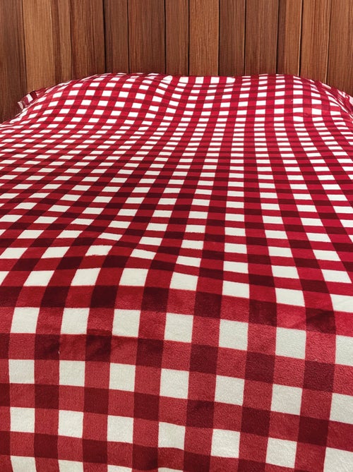 Capa de sofá e de cama de lã em xadrez - Kiabi Capa de sofá e de cama de lã em xadrez - Kiabi