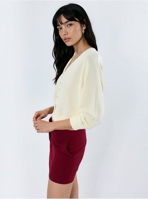 Cardigan curto canelado com decote em v busem - Kiabi Cardigan curto canelado com decote em v busem - Kiabi