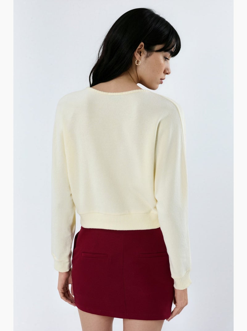 Cardigan curto canelado com decote em v busem Creme - Kiabi