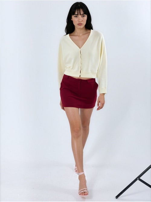 Cardigan curto canelado com decote em v busem - Kiabi Cardigan curto canelado com decote em v busem - Kiabi