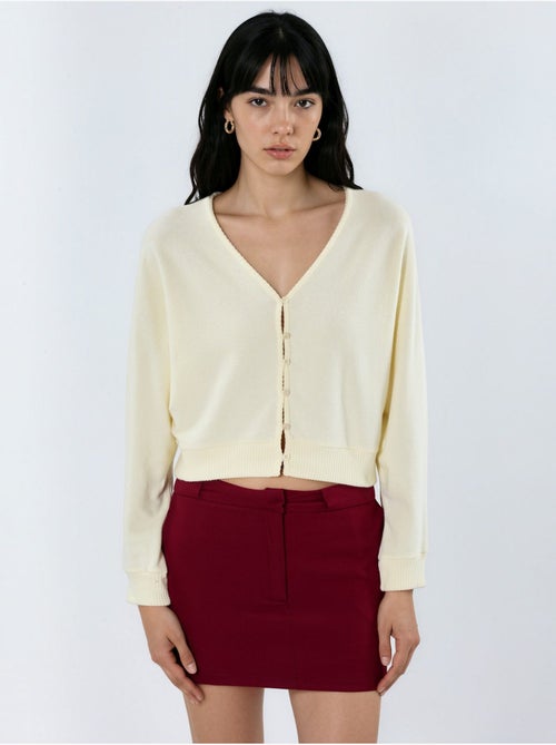 Cardigan curto canelado com decote em v busem - Kiabi Cardigan curto canelado com decote em v busem - Kiabi