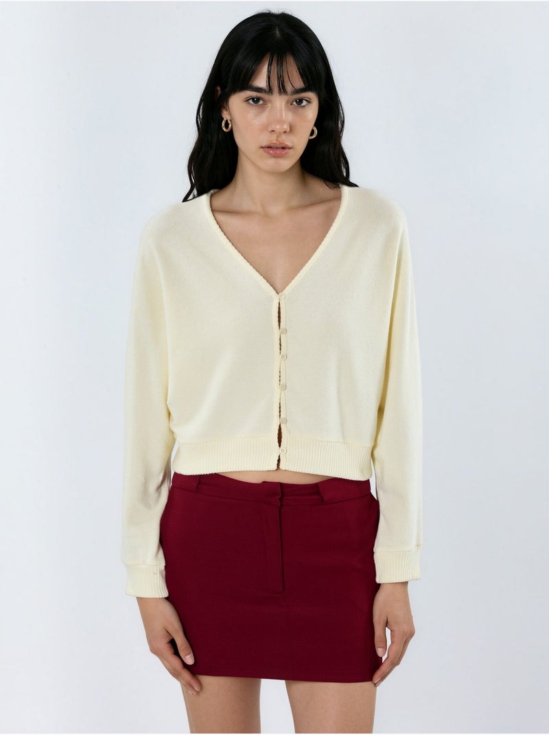 Cardigan curto canelado com decote em v busem Creme - Kiabi