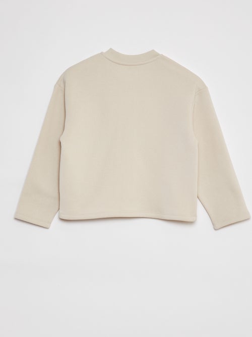 Casaco de manga comprida com abertura com molas de pressão - Kiabi Casaco de manga comprida com abertura com molas de pressão - Kiabi