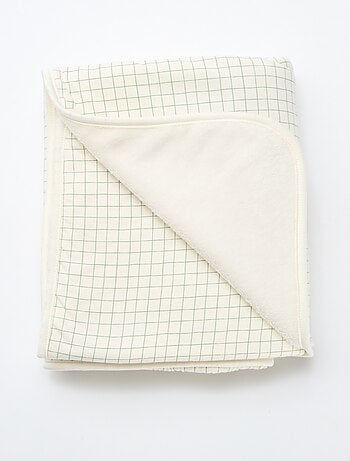 Cobertor estampado com interior efeito polar