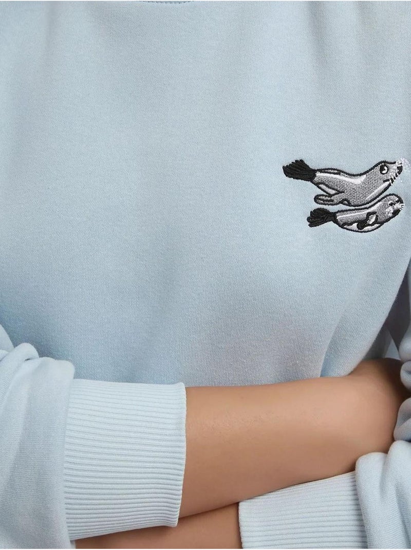 Comfort sweatshirt de gola redonda com padrão animal bordado em relevo hiccup Azul-pastel - Kiabi