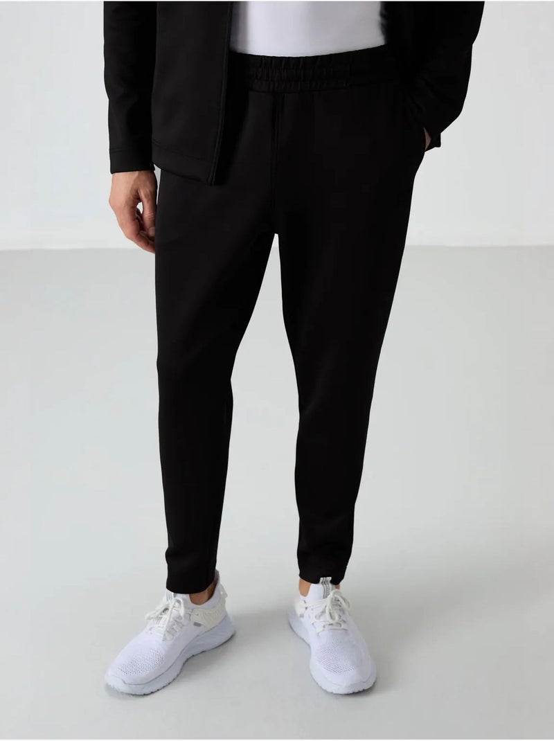 Conjunto active de homem em scuba de poliéster com gola com fecho de correr tommy Preto - Kiabi