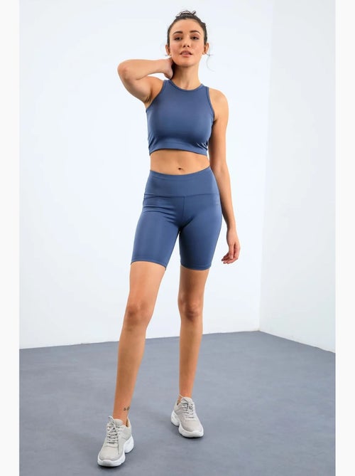 Conjunto active sem mangas com decote redondo e calções de ciclismo tommy - Kiabi Conjunto active sem mangas com decote redondo e calções de ciclismo tommy - Kiabi