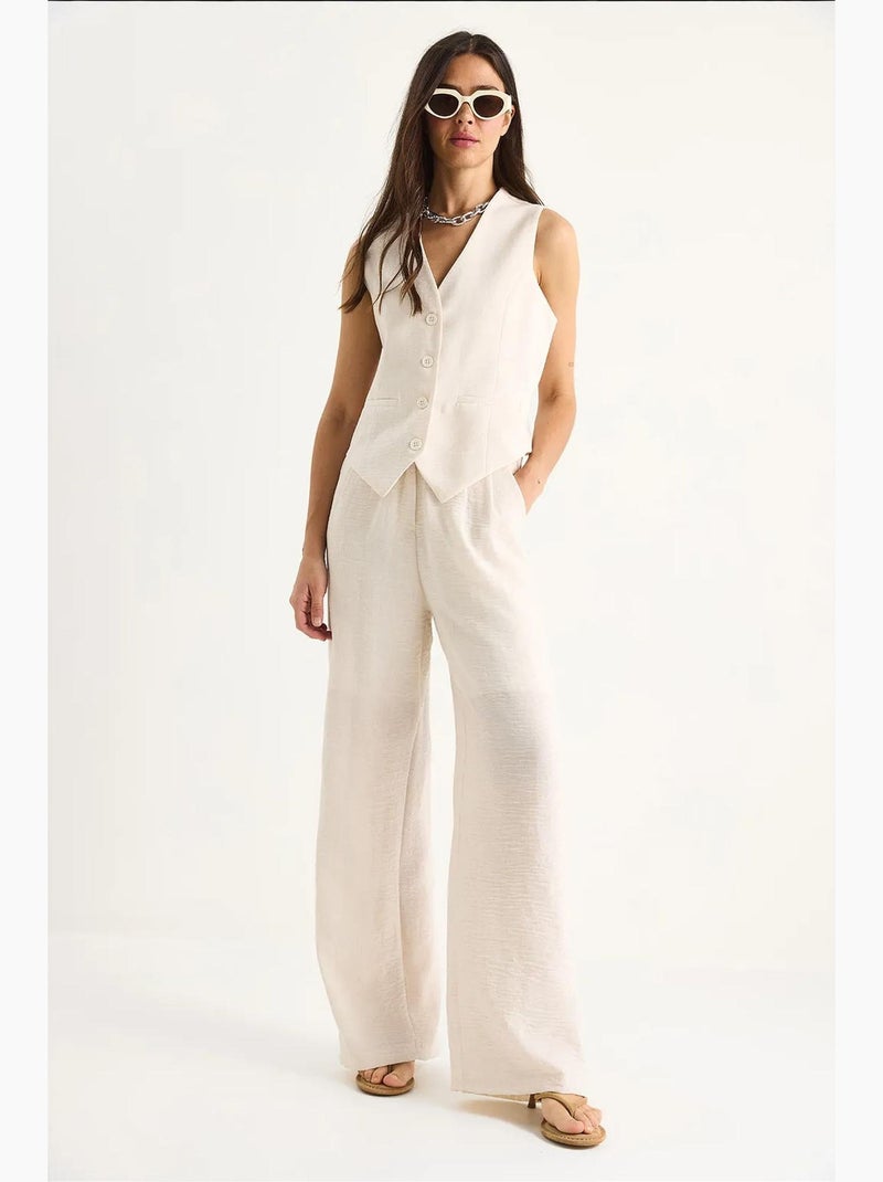 Conjunto coord de duas peças com colete de decote em v e calças de perna larga lucci Creme - Kiabi
